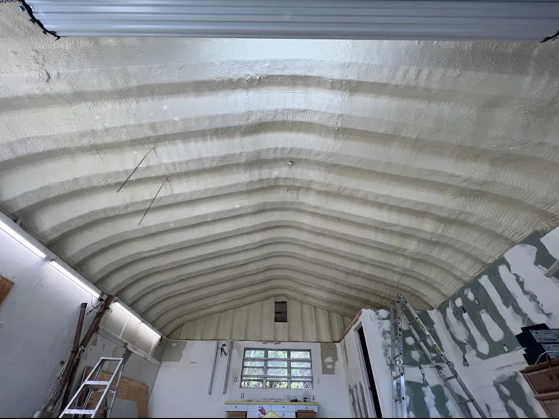 Spray polyurethane foam applied to the underside of a metal roof deck in The Colony